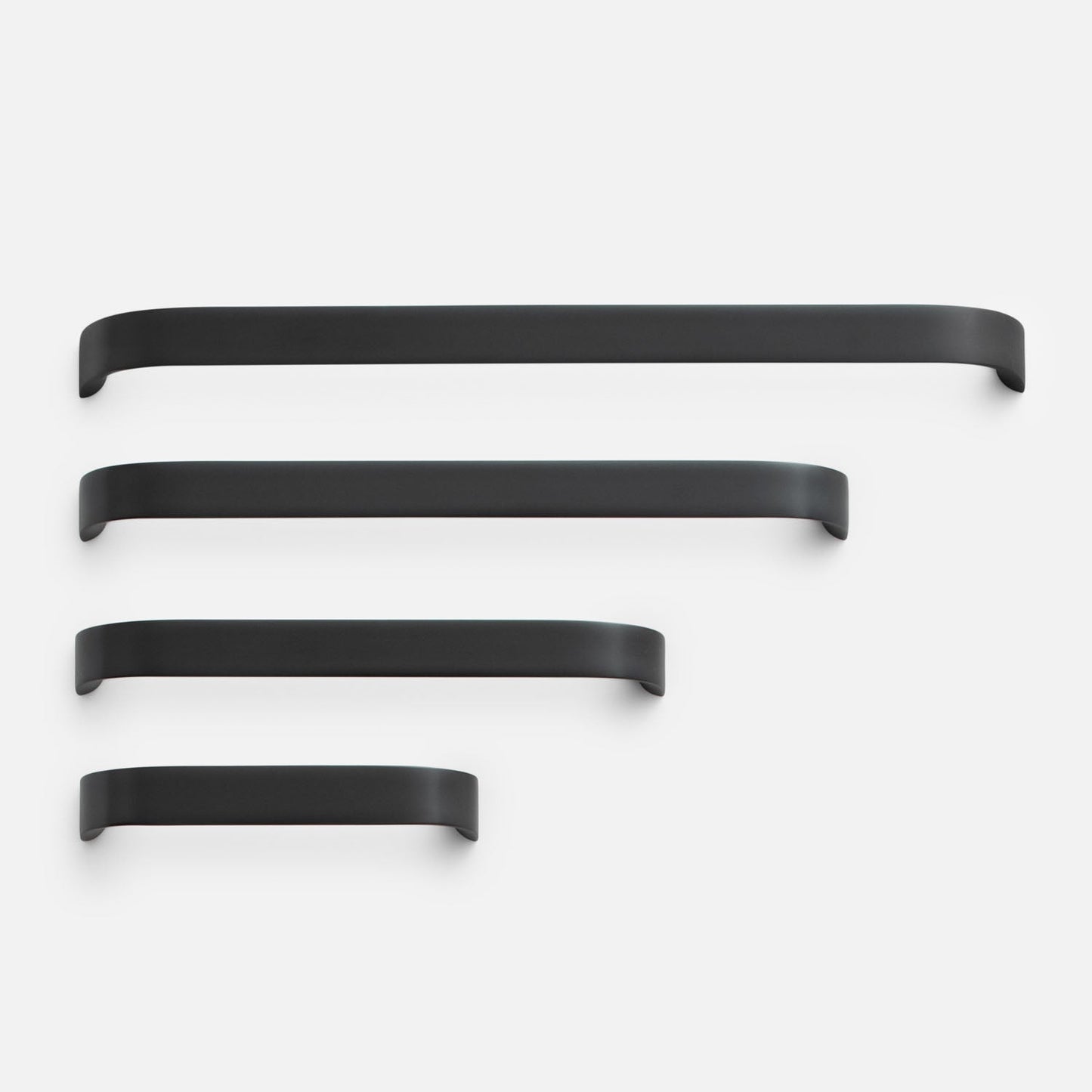 Front view of Cascade Pull showcasing four black pulls in graduated sizes against a white background