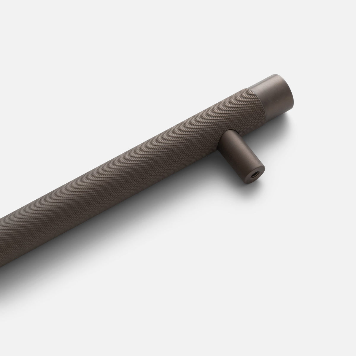 Close-up view of Knurled Appliance Pull showcasing cross-hatched texture in oil-rubbed bronze on a white background
