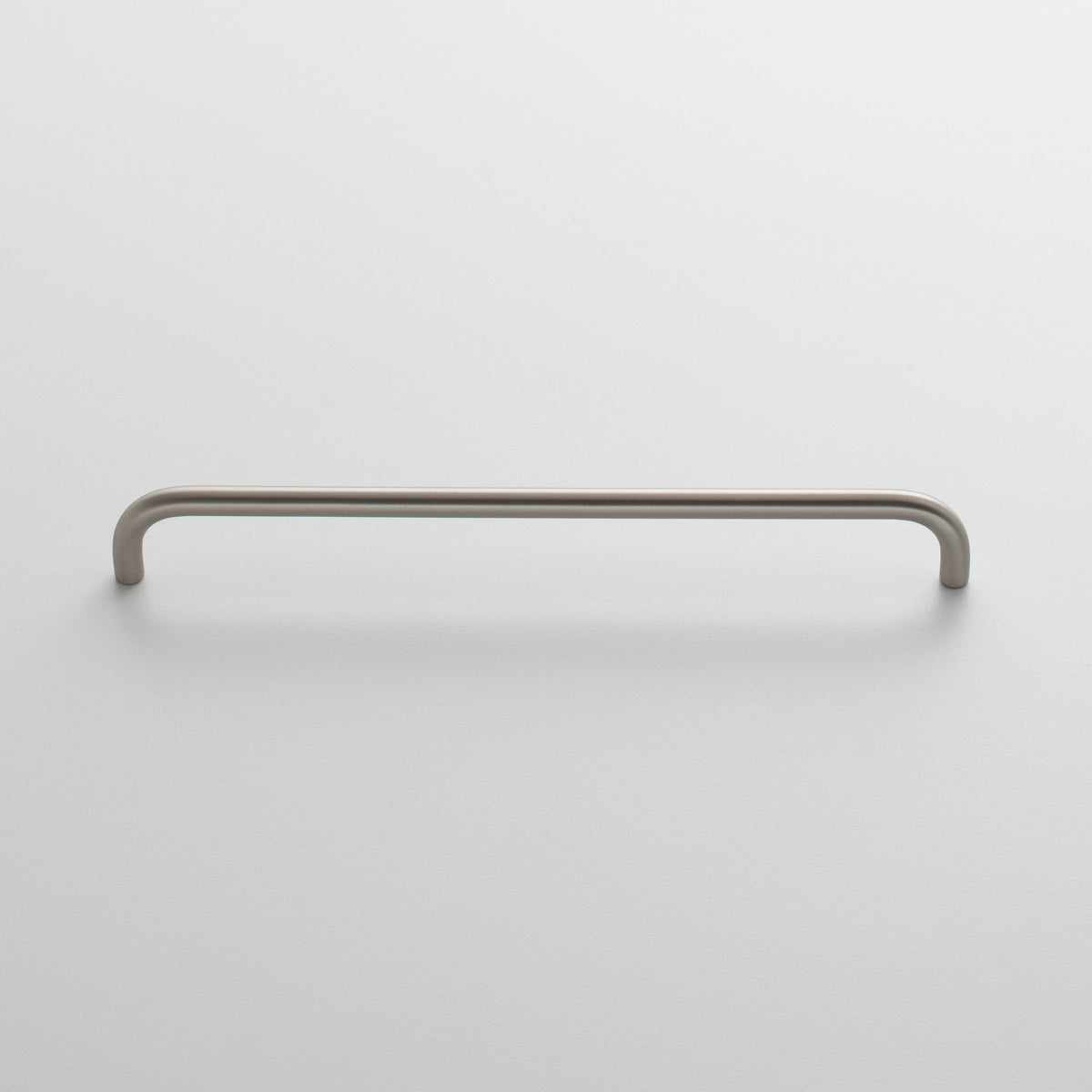 Front view of Parker Pull showcasing its long rounded bar and two mounting ends with a light gray background