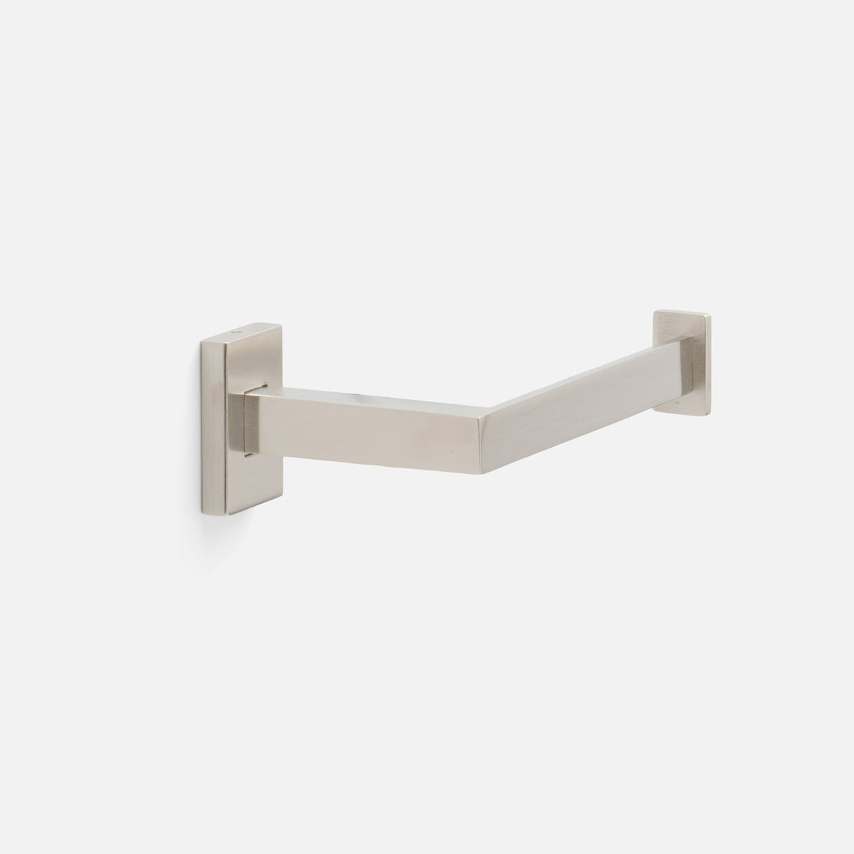 Angled view of Edgecliff Tissue Holder showcasing its satin nickel finish and solid brass construction with a light gray background