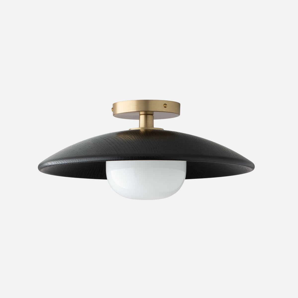 Front view of Atwood Wood Flush Mount 16 inch showcasing a curved oak shade, opal glass diffuser, and brass fixture
