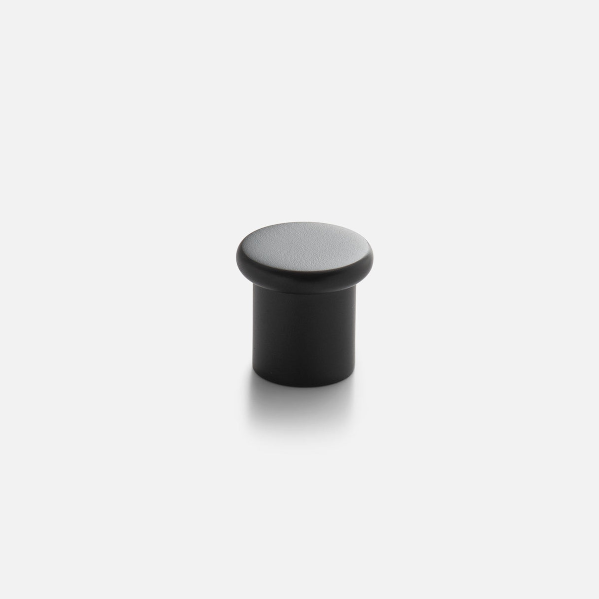 Close-up view of Remy Knob showcasing its rounded top and cylindrical shape on a white background