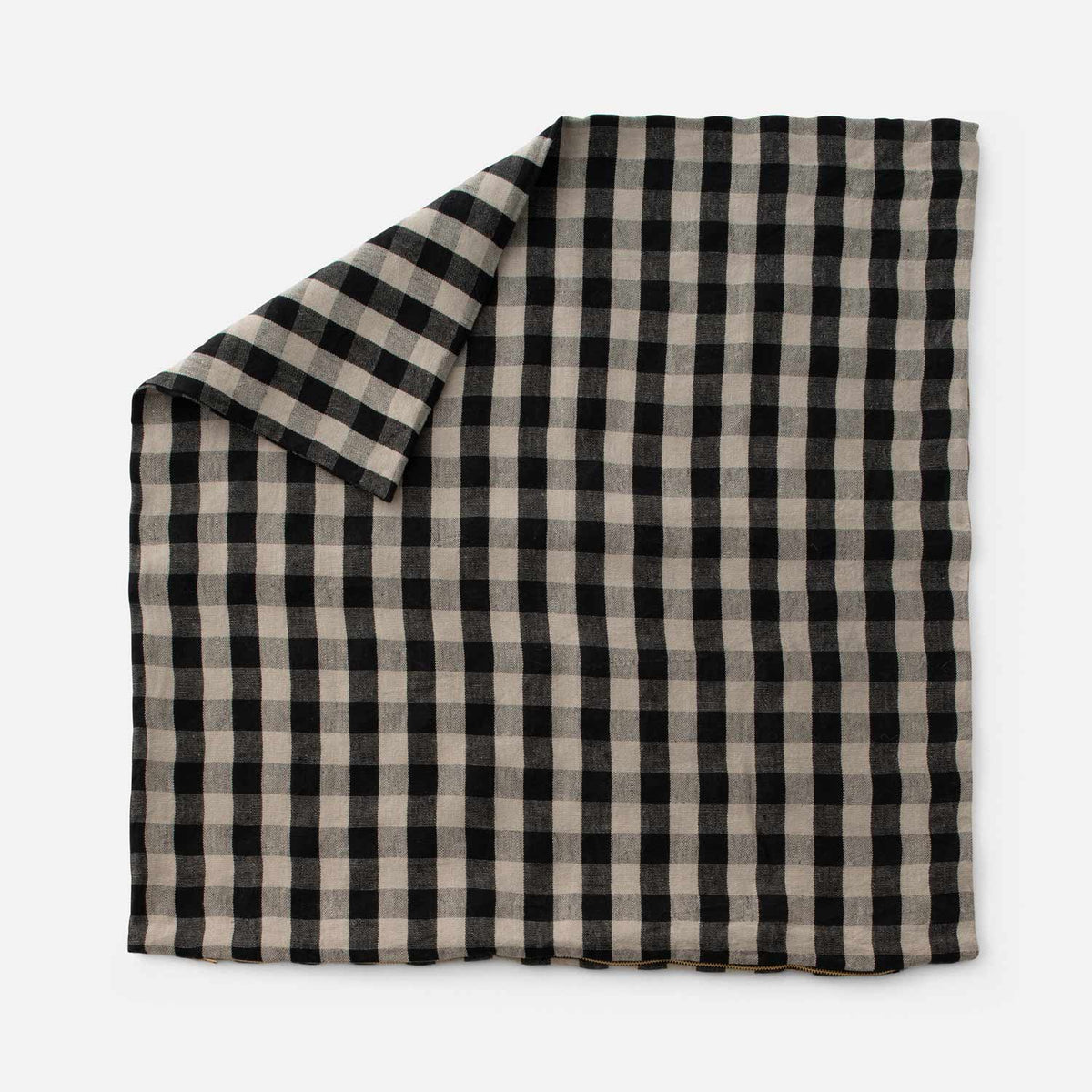 Top view of Linen Check Throw Pillow showcasing its black and natural check pattern on a white background