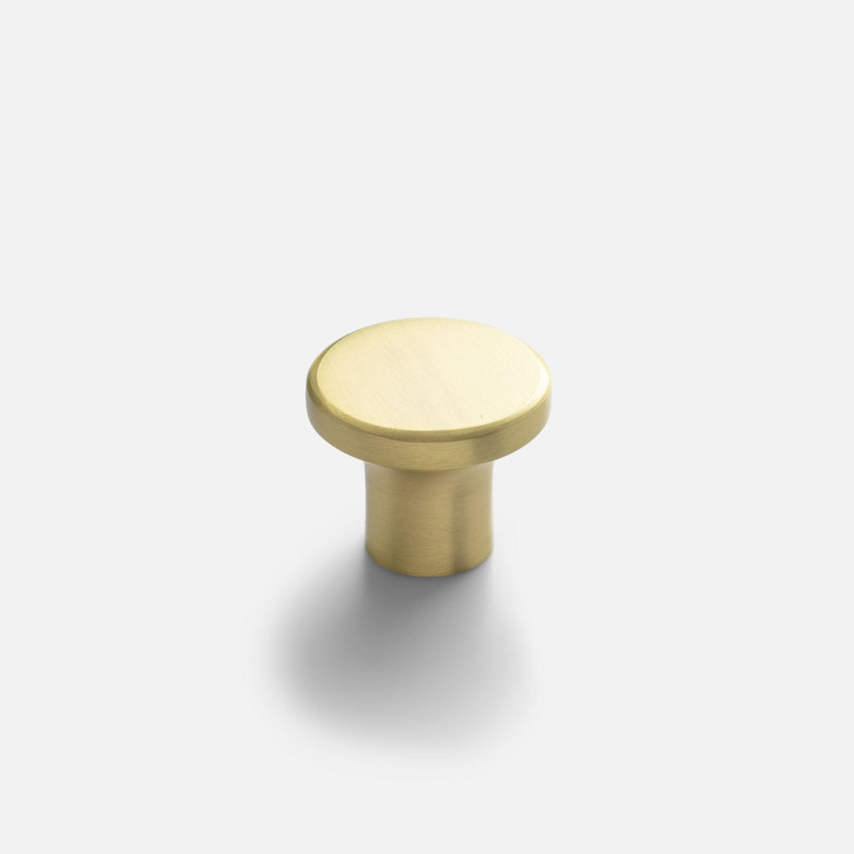Front three-quarter view of Roland cabinet knob showcasing its solid-brass construction with a light gray background