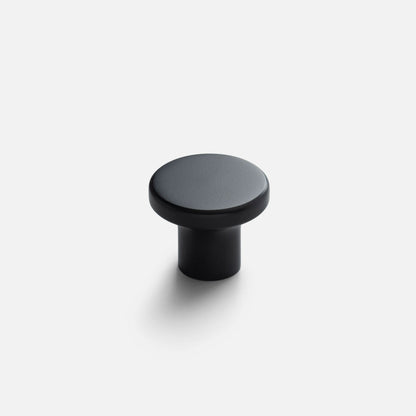 Front view of Roland Cabinet Knob showcasing black finish and round profile with white background