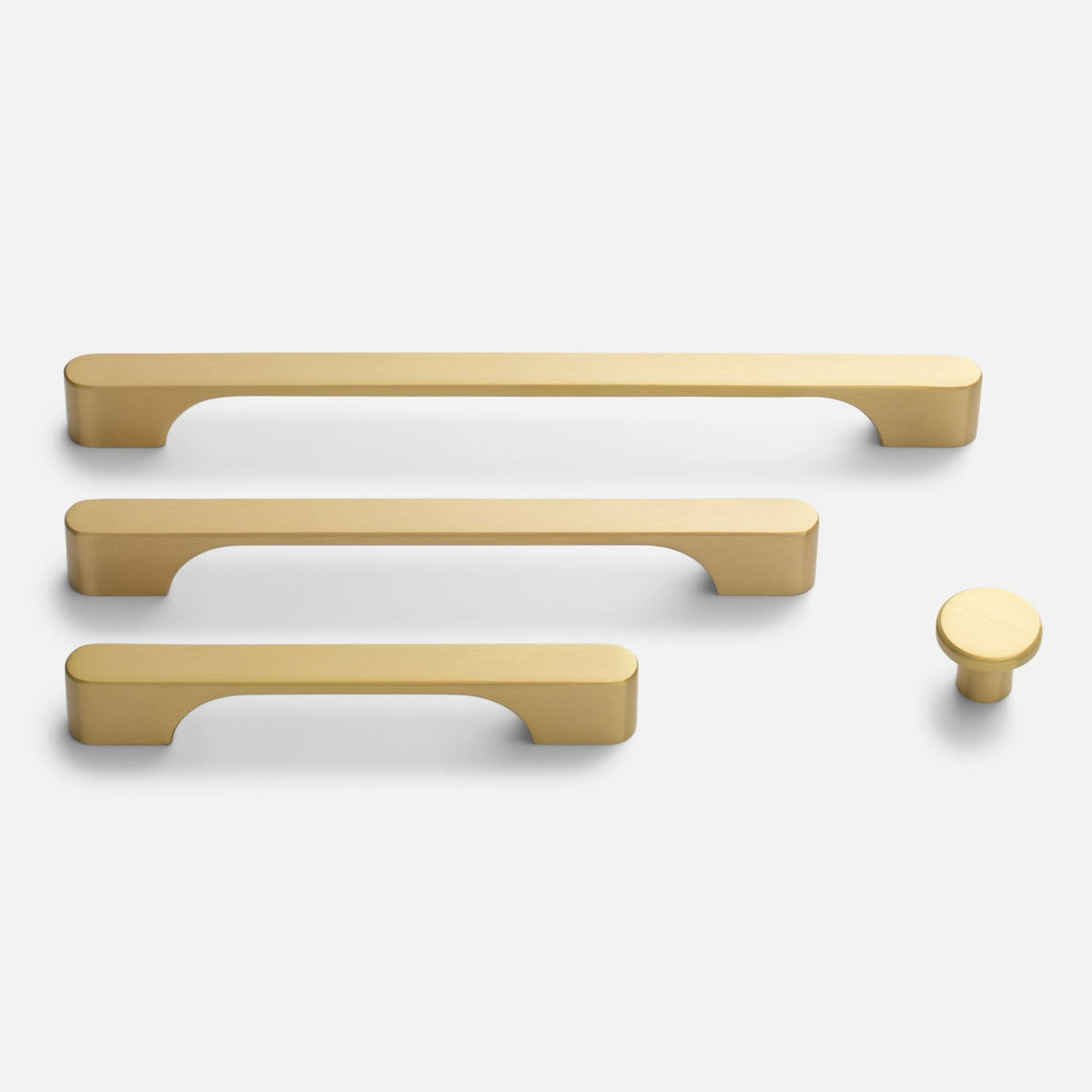 Front view of Roland Cabinet Knob with matching solid-brass pulls on a white background