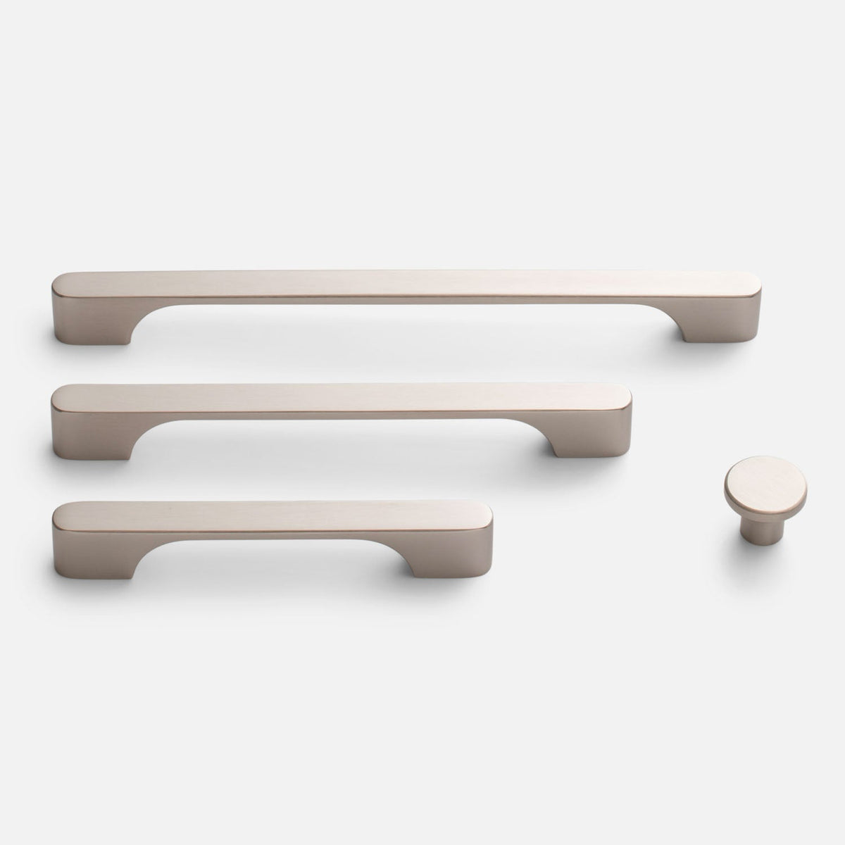 Front view of Roland cabinet knob with three matching cabinet pulls on a white background