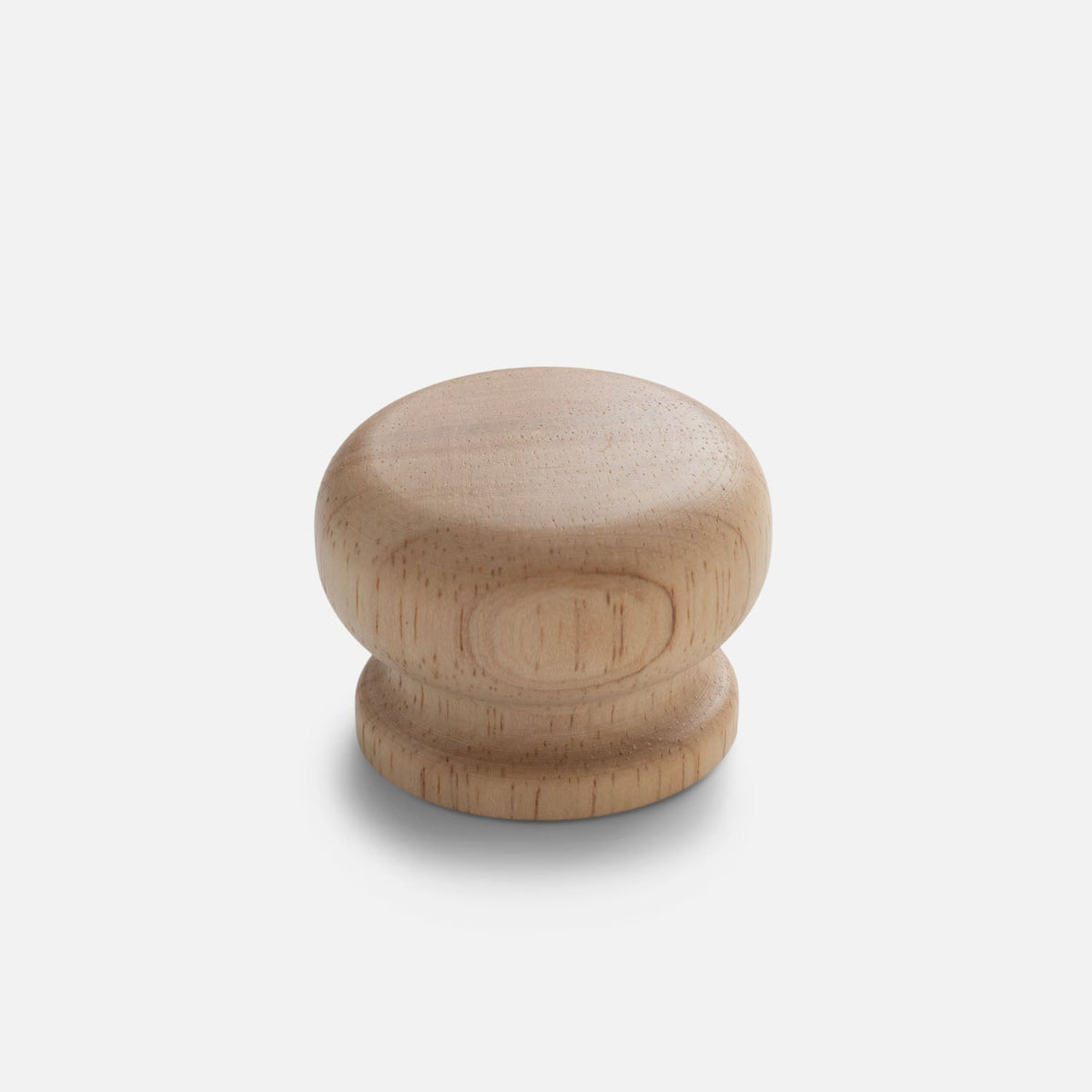 Front view of Turned Wood Knob showcasing solid wood construction and natural grain with a light gray background