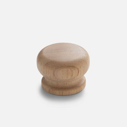 Front view of Turned Wood Knob showcasing solid wood construction and natural grain with a light gray background
