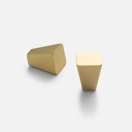 Two views of the Truss Knob showcasing its natural brass finish and tapered geometric design on a white background
