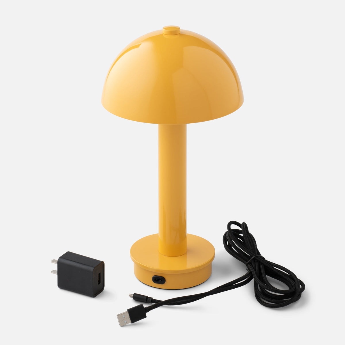 Front view of Sidnie Portable Lamp showcasing its mushroom shape with charging cable and adapter on white background