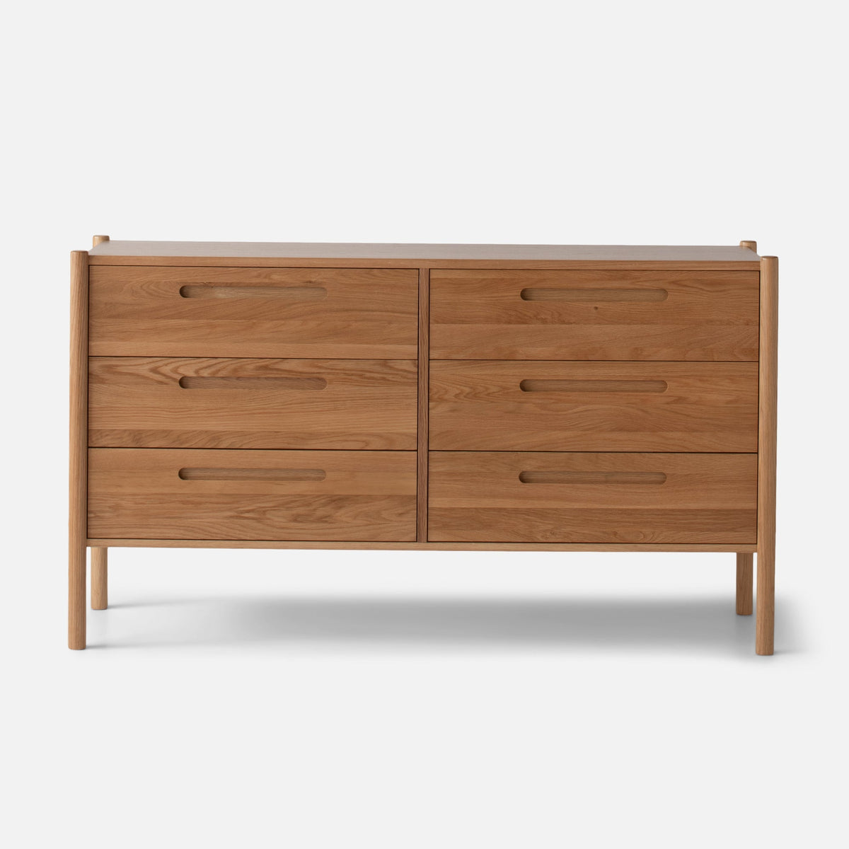 Front view of Nora 6-Drawer Dresser showcasing six drawers and pill-shaped handles against a light gray background