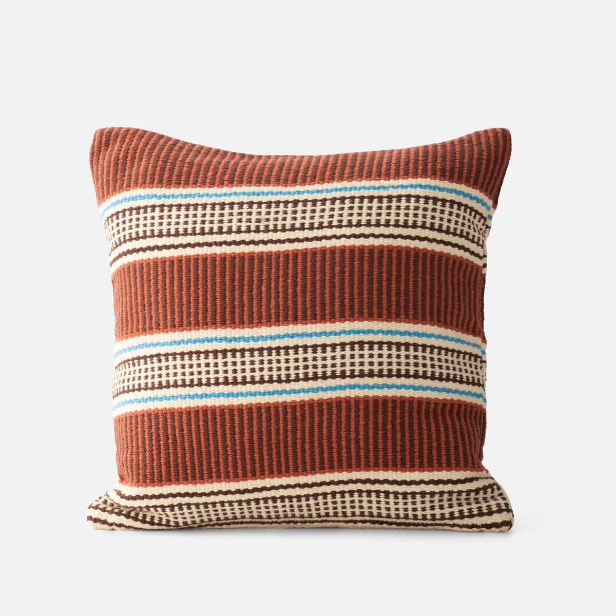 Front view of Anders Pillow Cover showcasing rust, brown, cream, and blue horizontal stripes with a light gray background