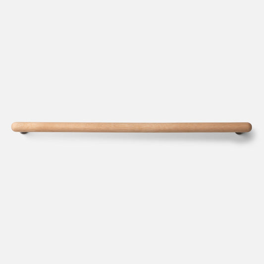 Front view of Oak Towel Bar showcasing its warm natural oak wood finish and rounded ends against a white background