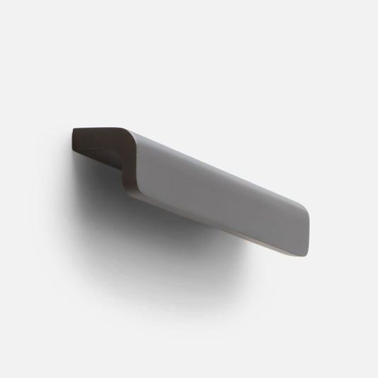 Angled view of the Moore Pull showcasing its soft curved profile in oil rubbed bronze against a light background