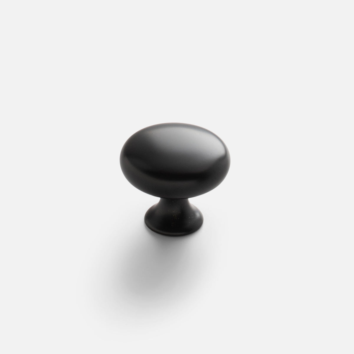 Front view of black Somerset Knob showcasing its egg-shaped silhouette with a light background