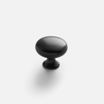 Front view of black Somerset Knob showcasing its egg-shaped silhouette with a light background