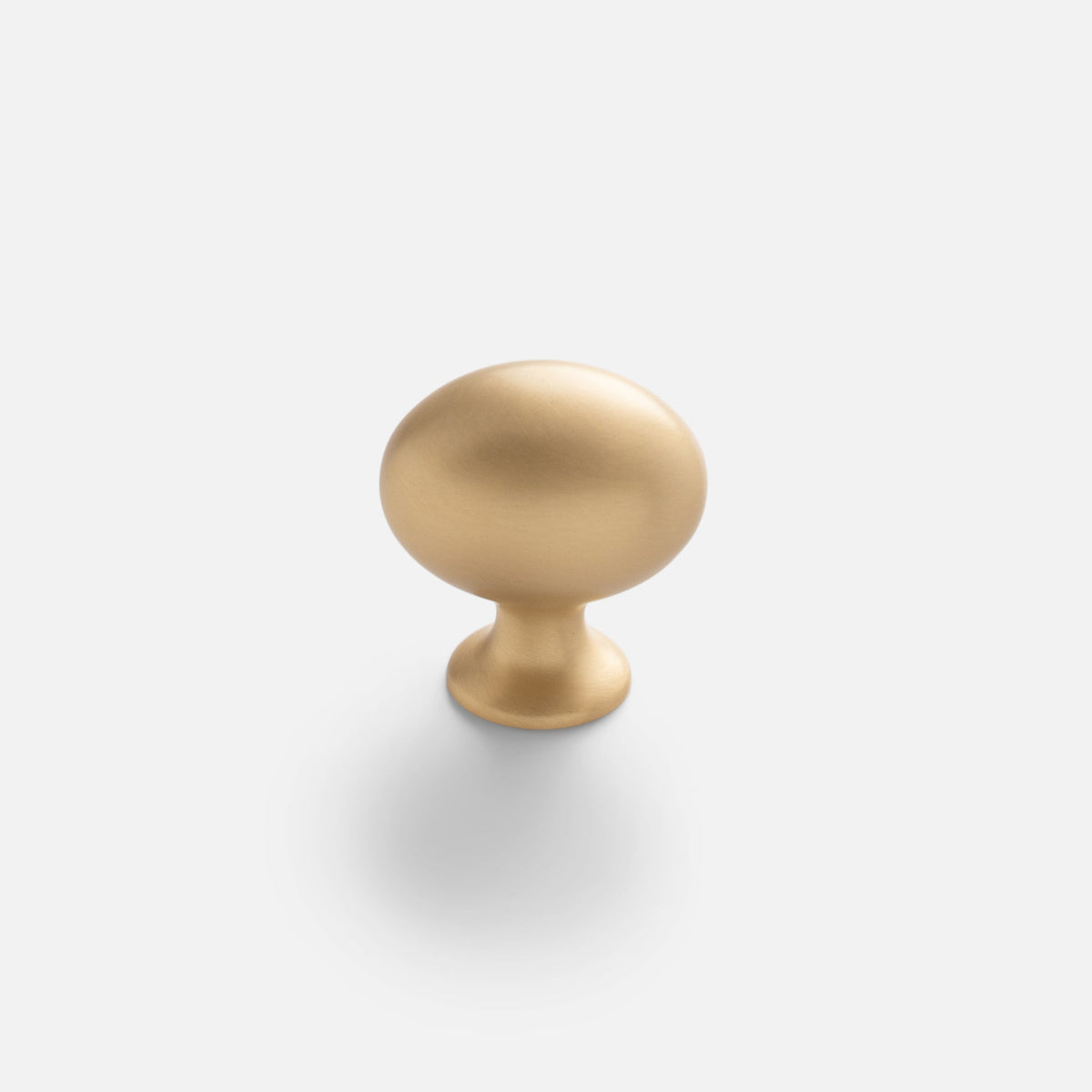 Front view of Somerset Knob showcasing its egg-shaped solid brass design against a white background