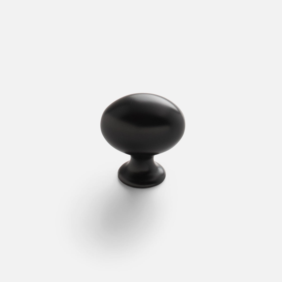 Front view of Somerset Knob showcasing its egg-shaped silhouette in black finish against a white background