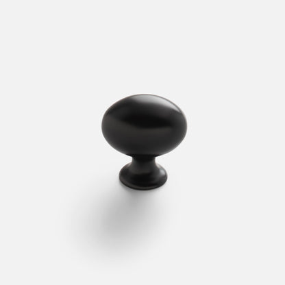 Front view of Somerset Knob showcasing its egg-shaped silhouette in black finish against a white background