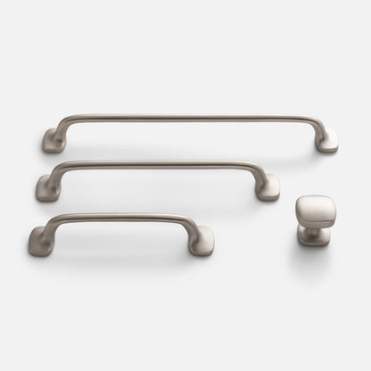 Front view of Hazel pulls in satin nickel showcasing multiple sizes and rounded antique latch inspired forms on a white background