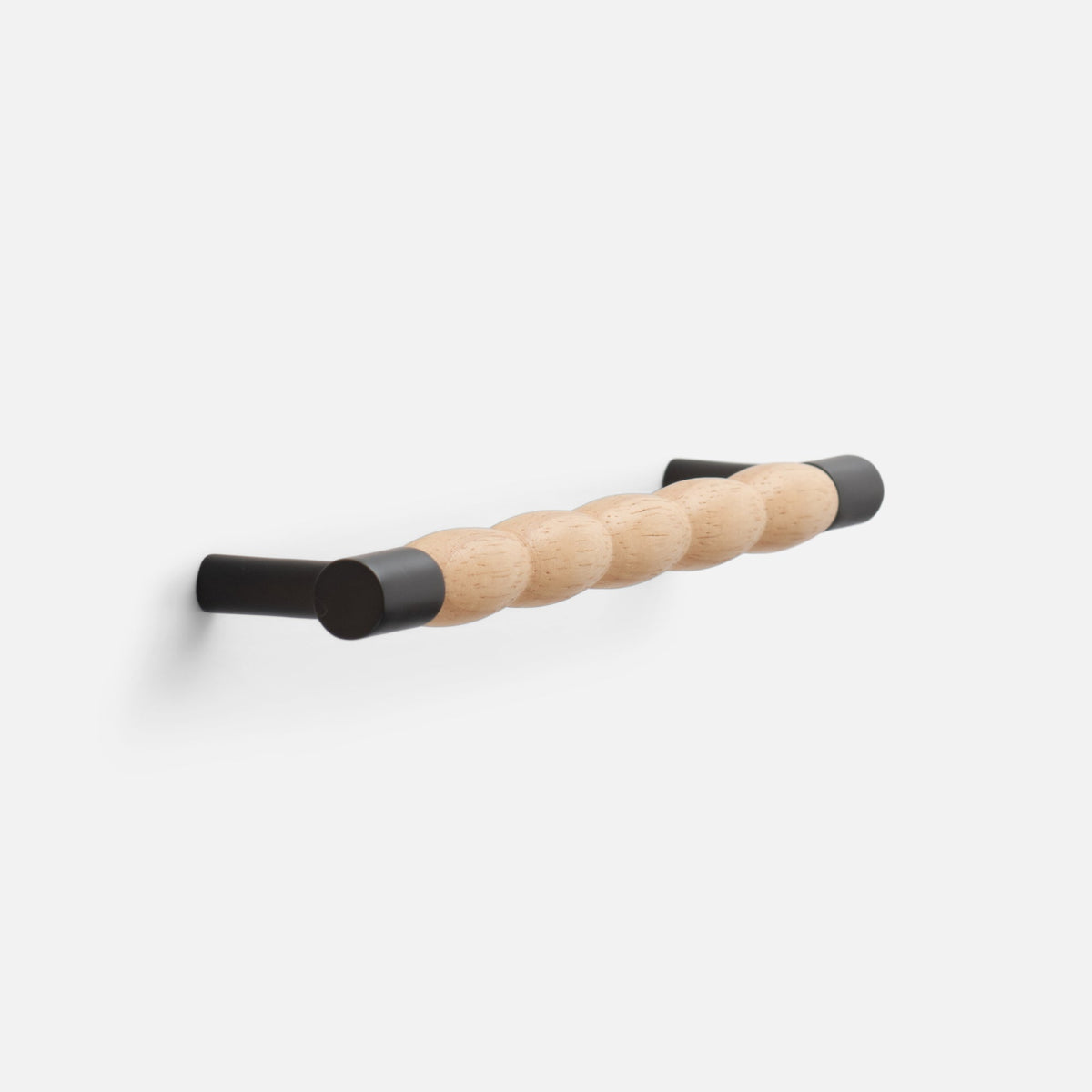Angled view of James Pull showcasing a white oak grip and oil rubbed bronze ends on a light background