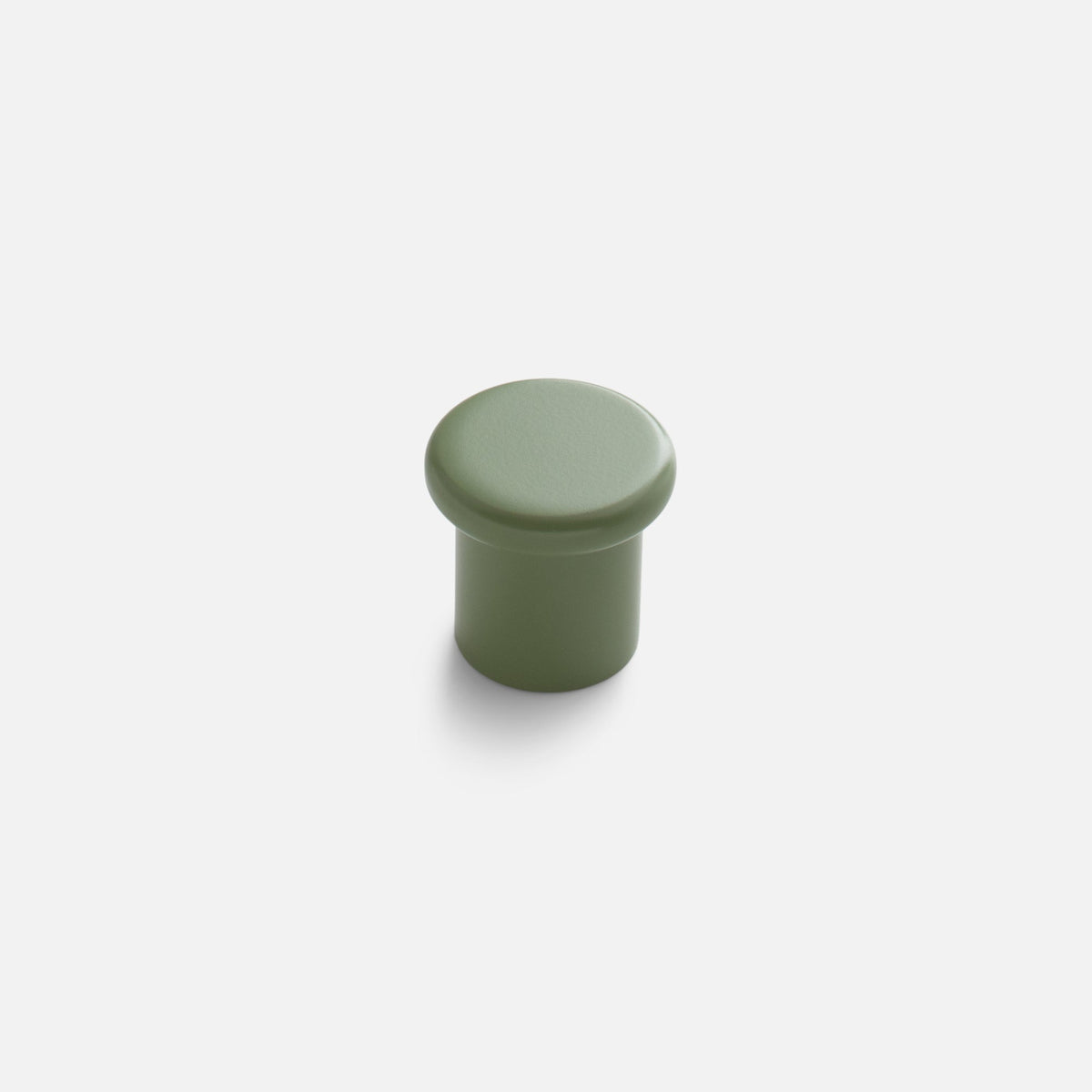 Front view of the Remy Knob showcasing its rounded green pull and cylindrical base against a white background