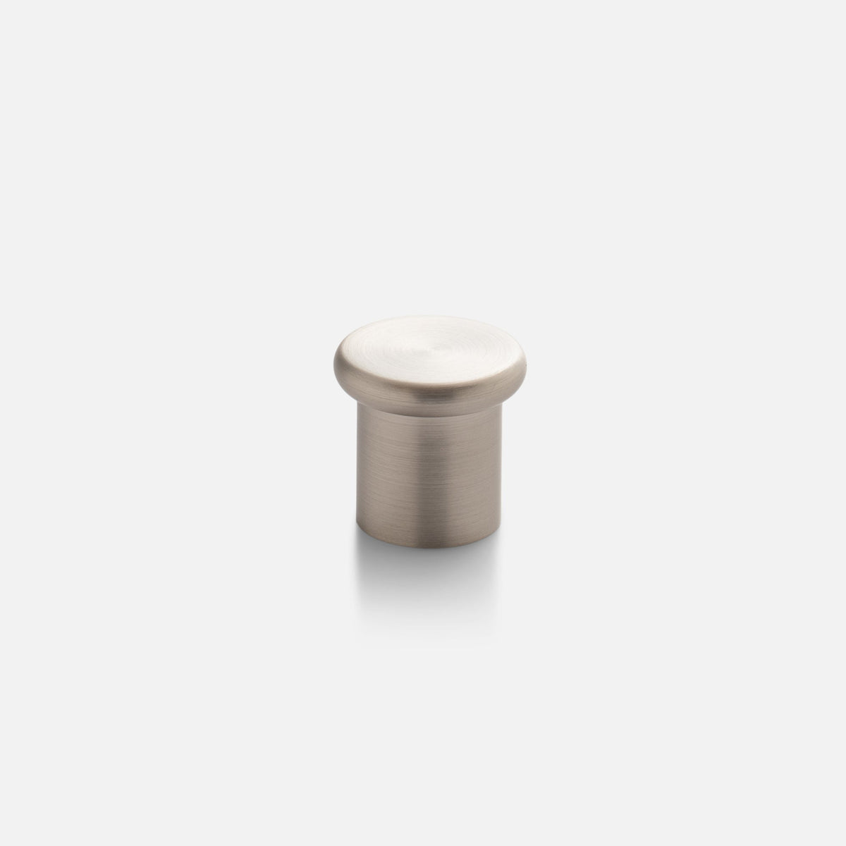 Front view of Remy Knob showcasing its solid brass construction and soft curves against a light background