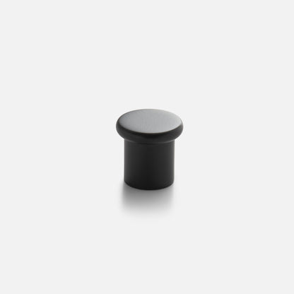 Close-up view of Remy Knob showcasing its rounded top and cylindrical shape on a white background