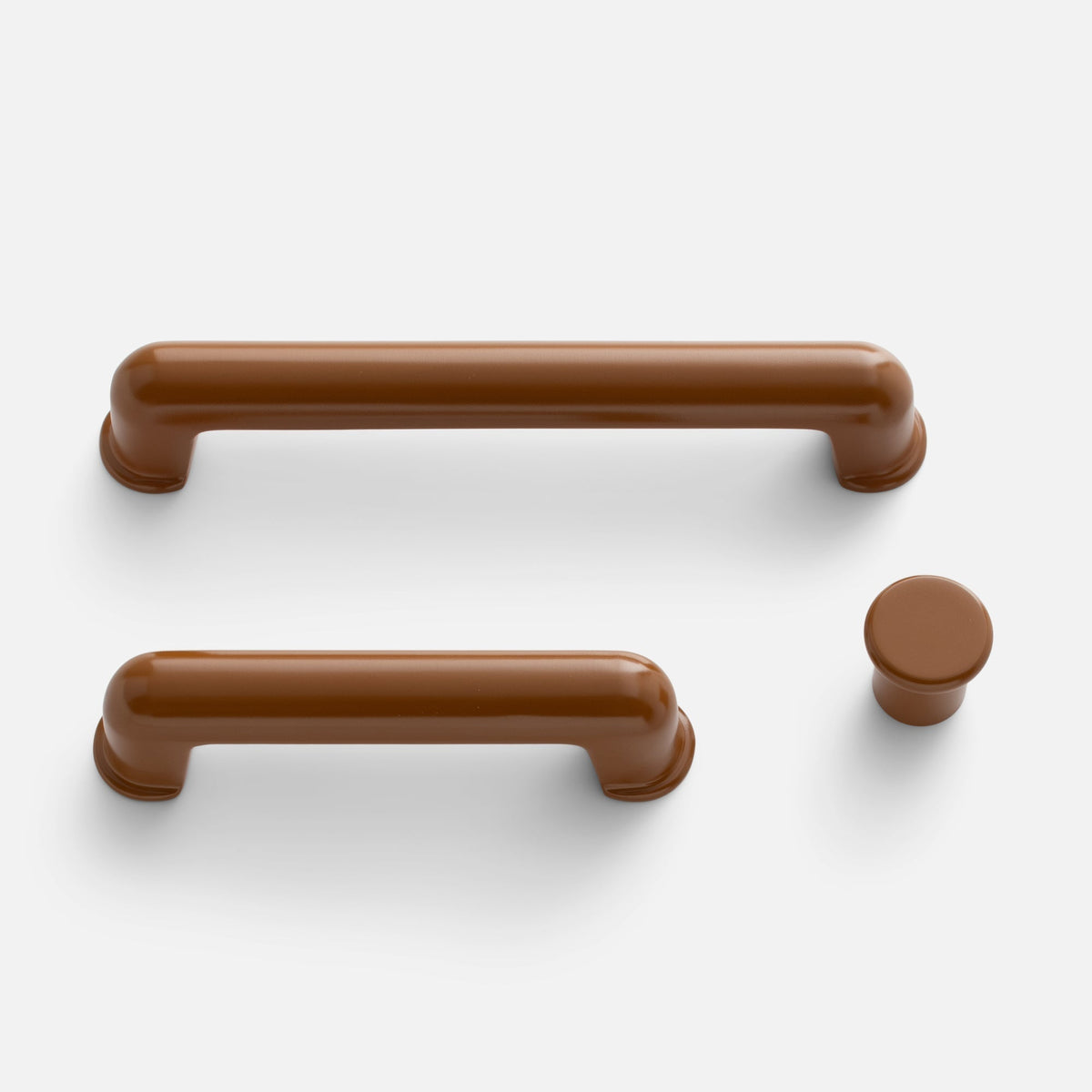 Top view of Remy Knob hardware showcasing rounded pull and knob shapes on a white background