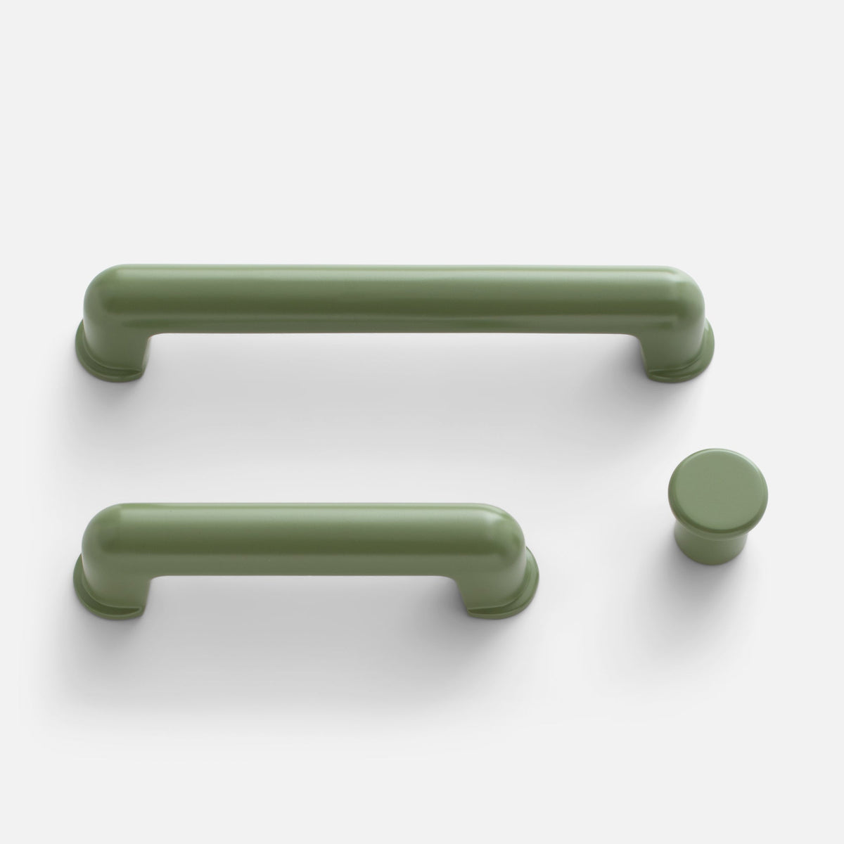 Front view of Remy Knob showcasing curved pulls and a round knob on a white background