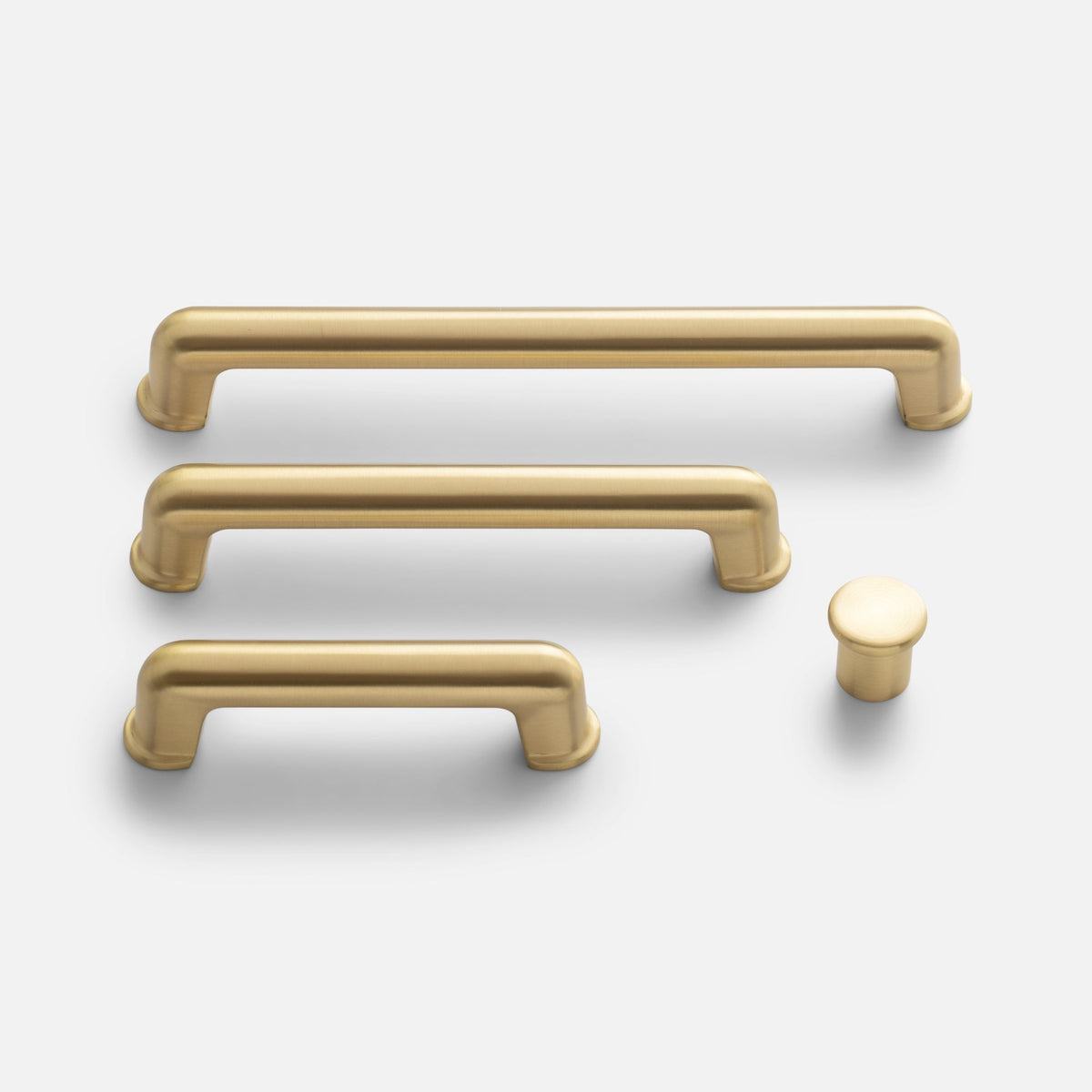 Front view of Remy Knob hardware showcasing solid brass pulls and knob on a white background