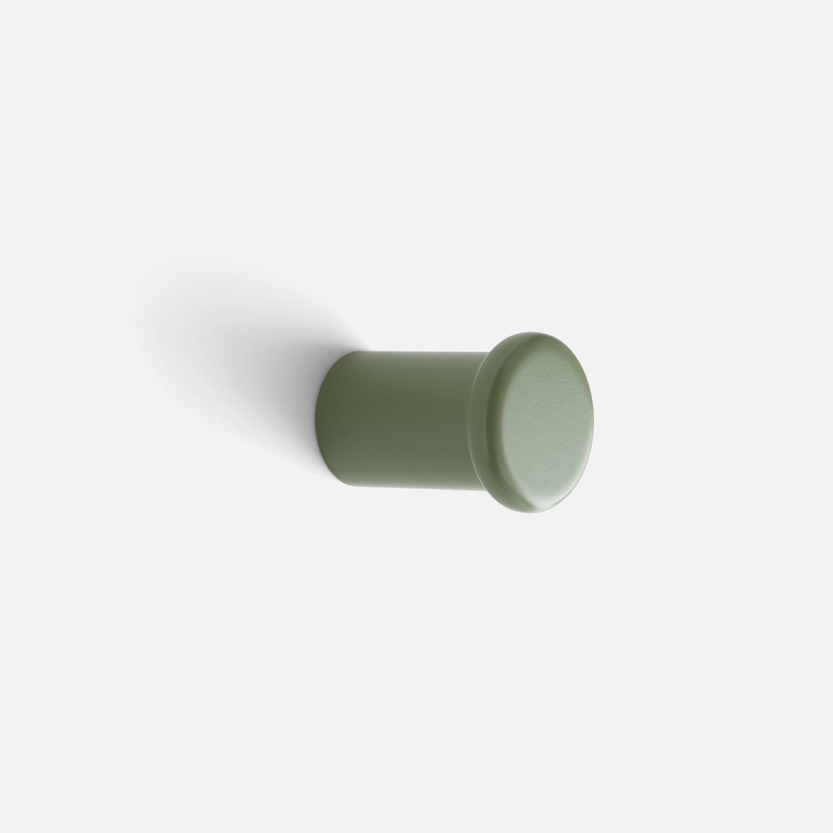 Close-up side view of Remy Single Hook showcasing its cylindrical form and rounded face against a white background