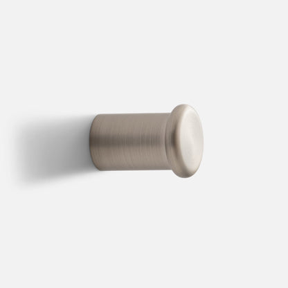 Close-up side view of Remy Single Hook showcasing its cylindrical form and rounded end cap against a white background