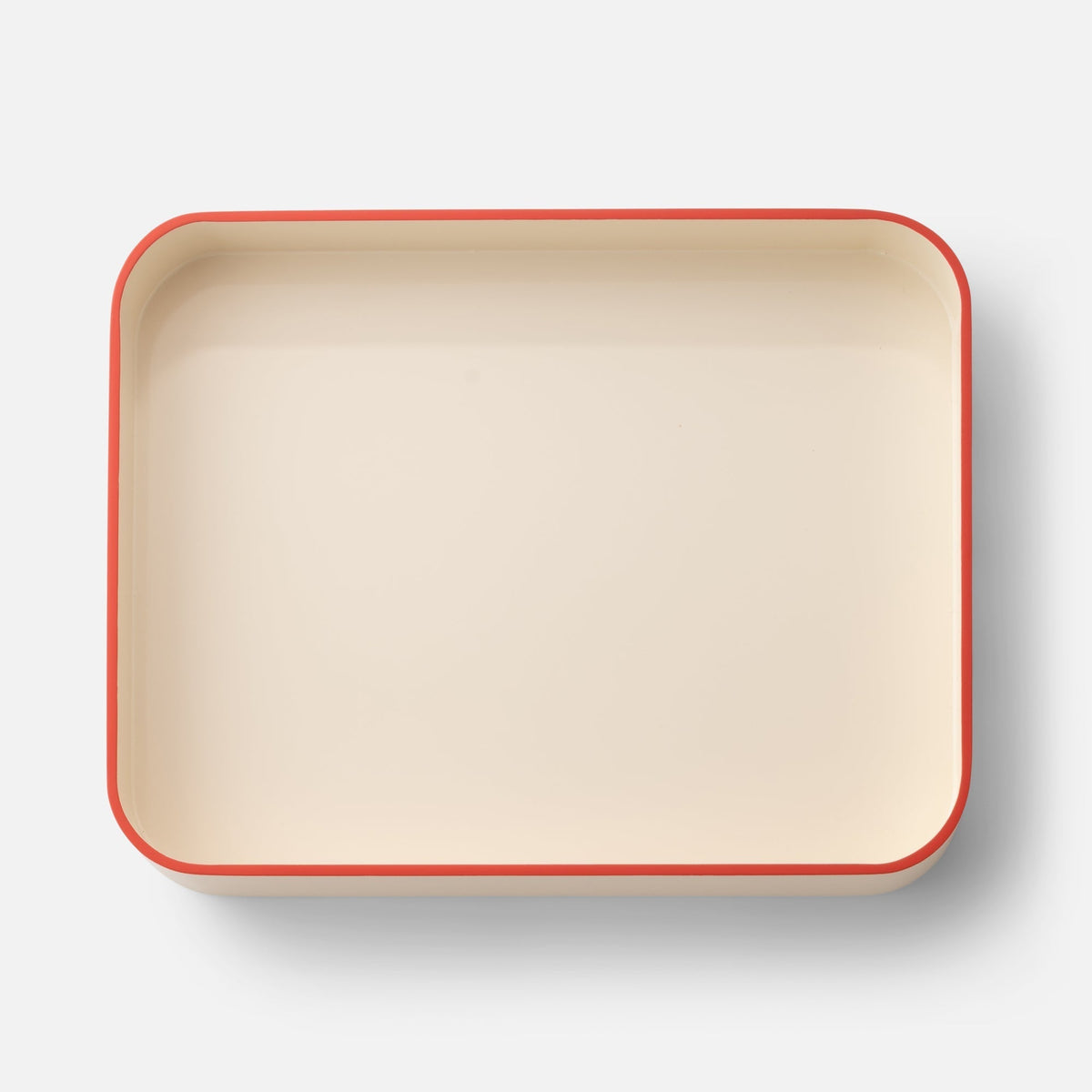 Top view of Clare V Sonia Tray showcasing a cream color and red rim with a white background