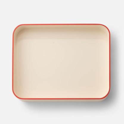 Top view of Clare V Sonia Tray showcasing a cream color and red rim with a white background