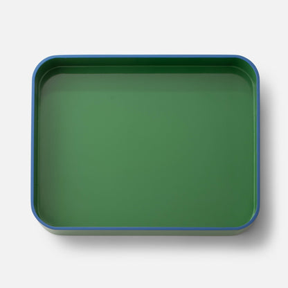Top view of Clare V Sonia Tray showcasing its green surface and blue rim against a white background