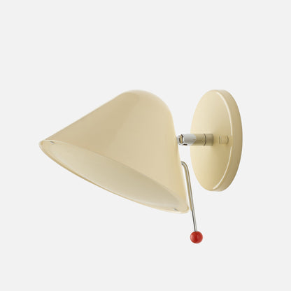 Angled view of Clare V Hans Wall Sconce showcasing ecru gloss shade, polished arm, and contrasting ball knob with white background