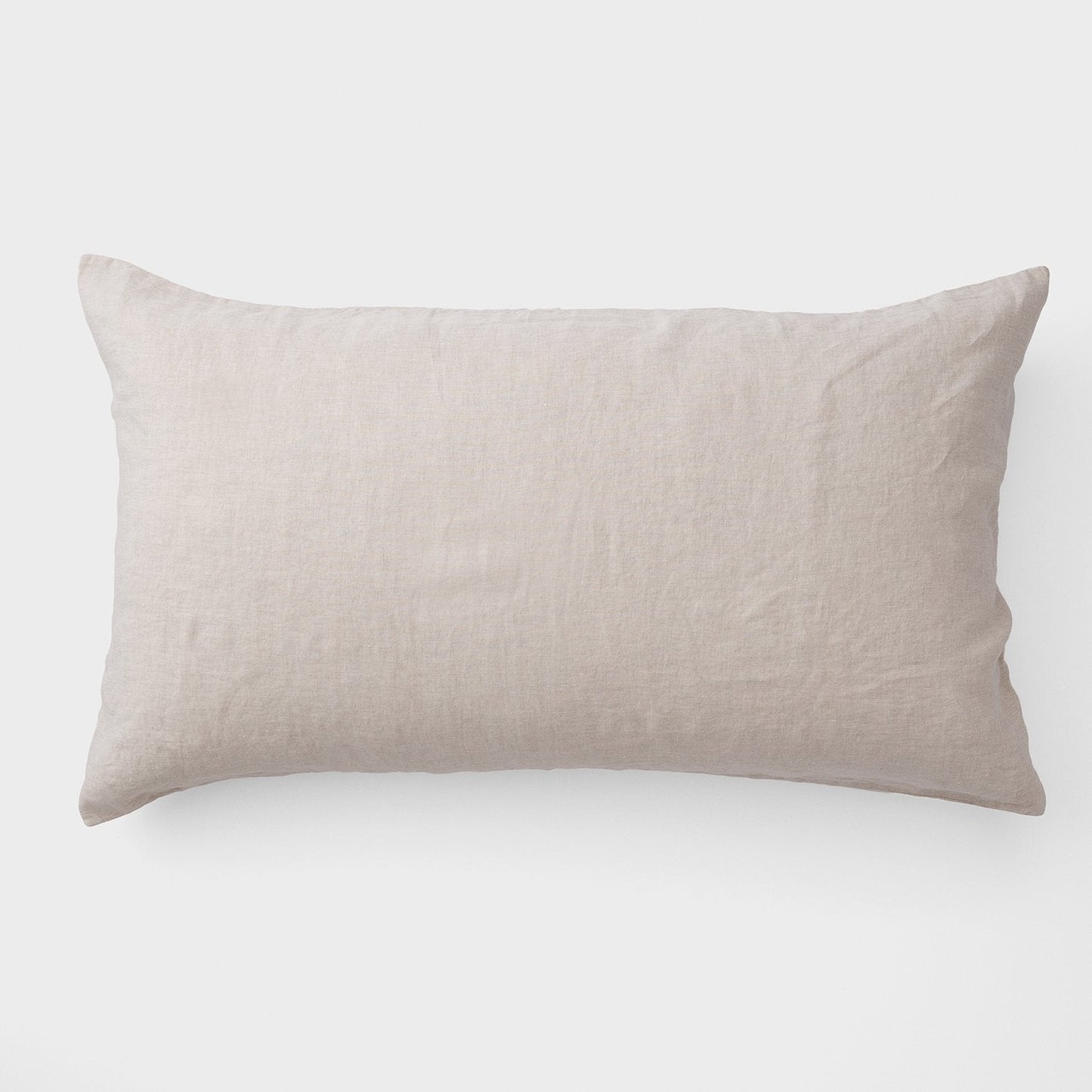 Top view of Linen Pillow Sham showcasing natural textured 100 percent linen fabric and back envelope closure on white background