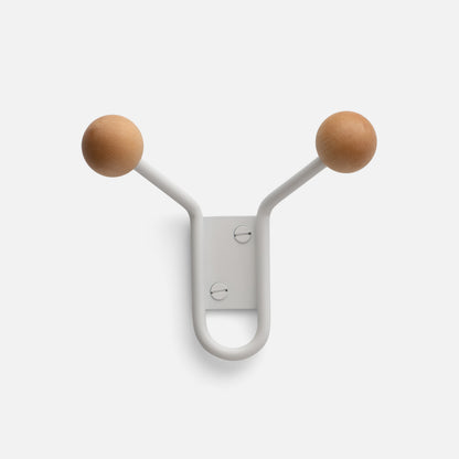 Front view of Mollie Hook showcasing its steel body and two oak knobs on a white background