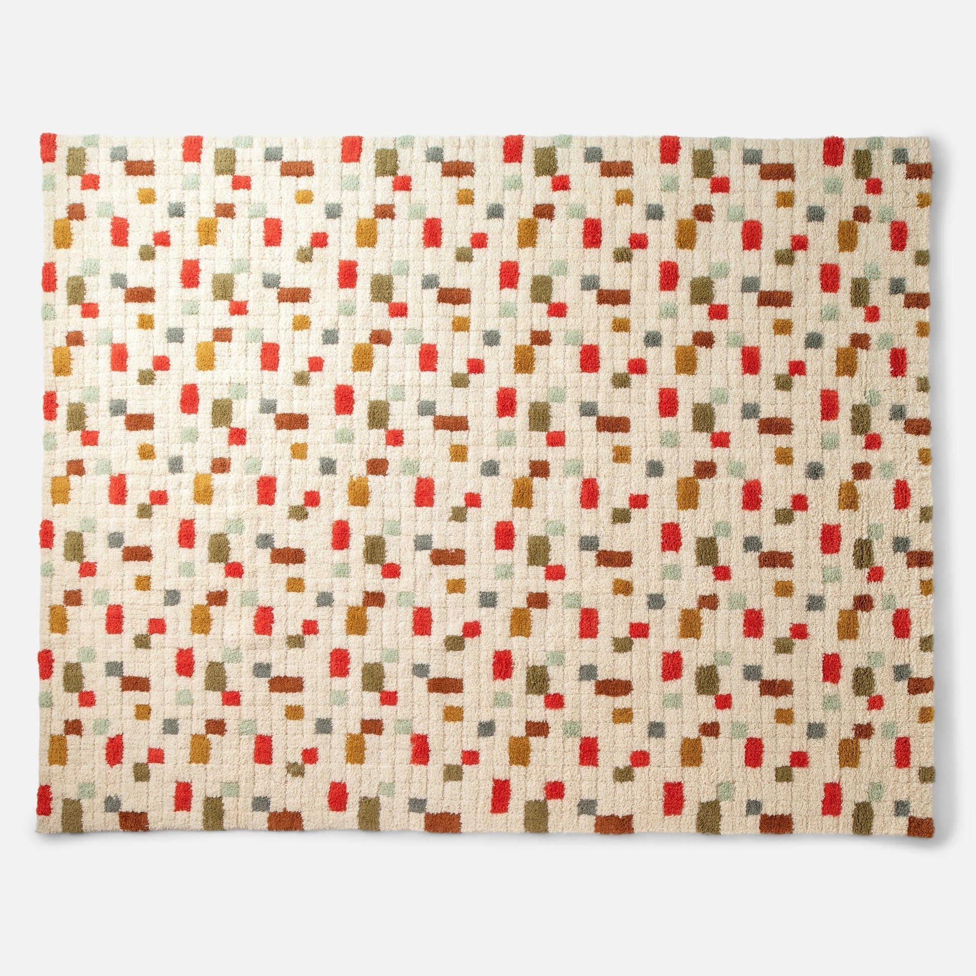 Top-down view of Pixel Handloom Shag Rug showing plush high-pile wool texture and multicolored pattern on white background