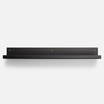 Front view of Brake Angle Picture Ledge in black satin showcasing brass mounting hardware with a white background