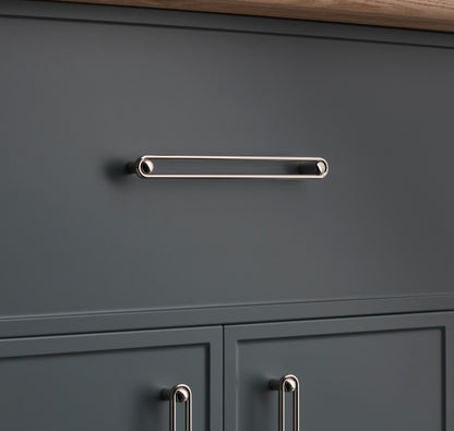 Front view of Landon Pull showcasing its elongated rounded rectangular design on a dark gray cabinet