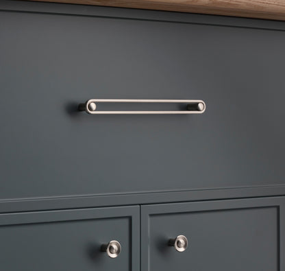 Front view of Landon Pull showcasing its elongated bar design on dark gray cabinetry