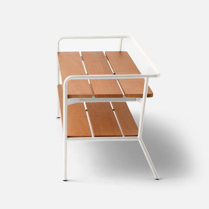 Angled view of Ronda Entryway Bench showcasing Shell White Satin steel tubing and teak slats on a white background