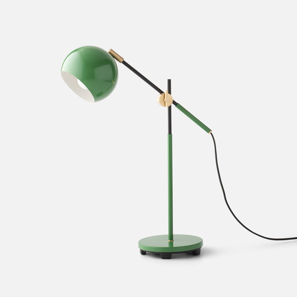Front view of the green Isaac Desk Lamp showcasing its adjustable arm and swiveling shade on a white background