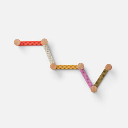 Front view of Tula Hook showcasing multicolor perforated aluminum sections with natural wood finials on a light gray background