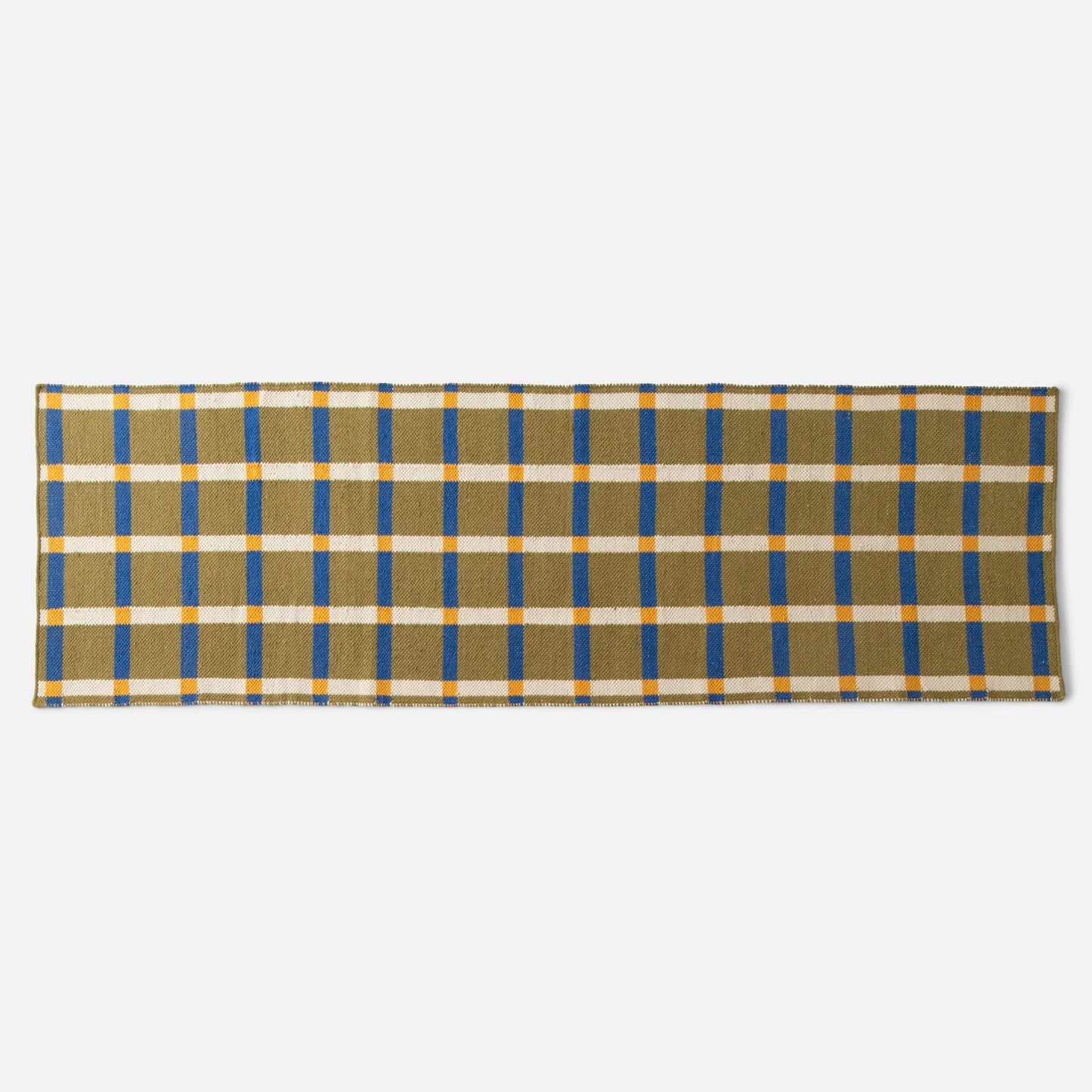 Flat lay of Plaid Wool Reversible Rug showing olive handwoven wool plaid with blue and yellow stripes on white background