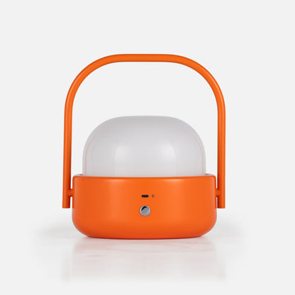 Front view of Cooper table lamp showcasing orange finish, dome shade, and curved handle against a white background
