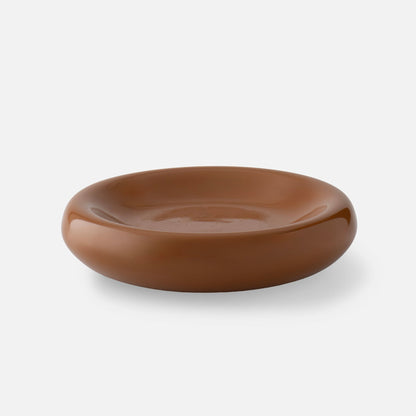Front view of Schoolhouse and Clare V Yves Cast Metal Catch All showcasing its low, rounded brown dish shape on a white background